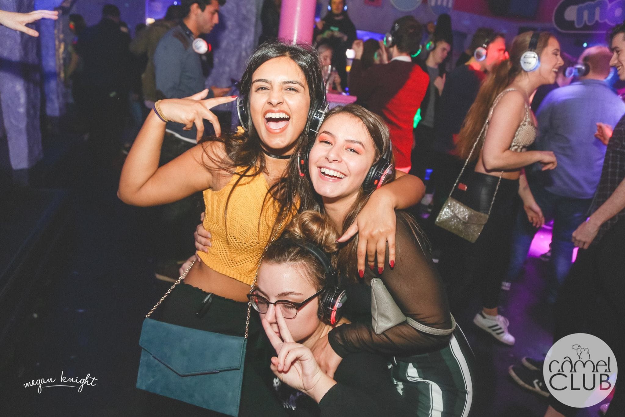 three girls having fun at the silent disco in huddersfield
