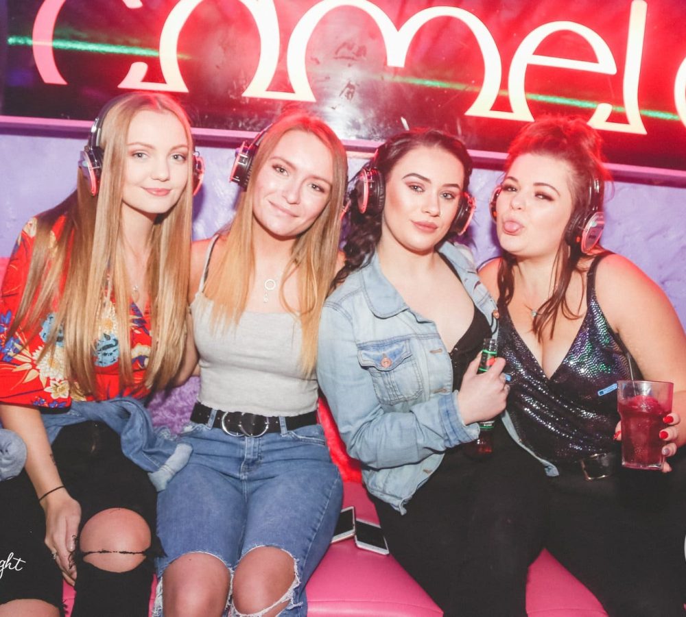 group of friends enjoying silent disco at the camel club in huddersfield