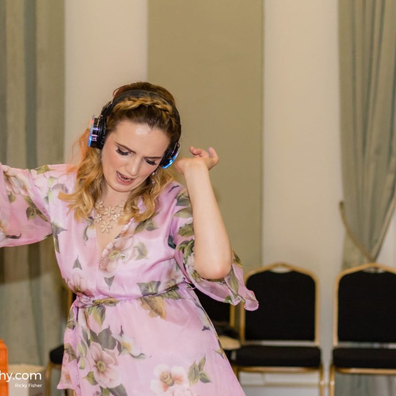 girl having fun at a silent disco wedding